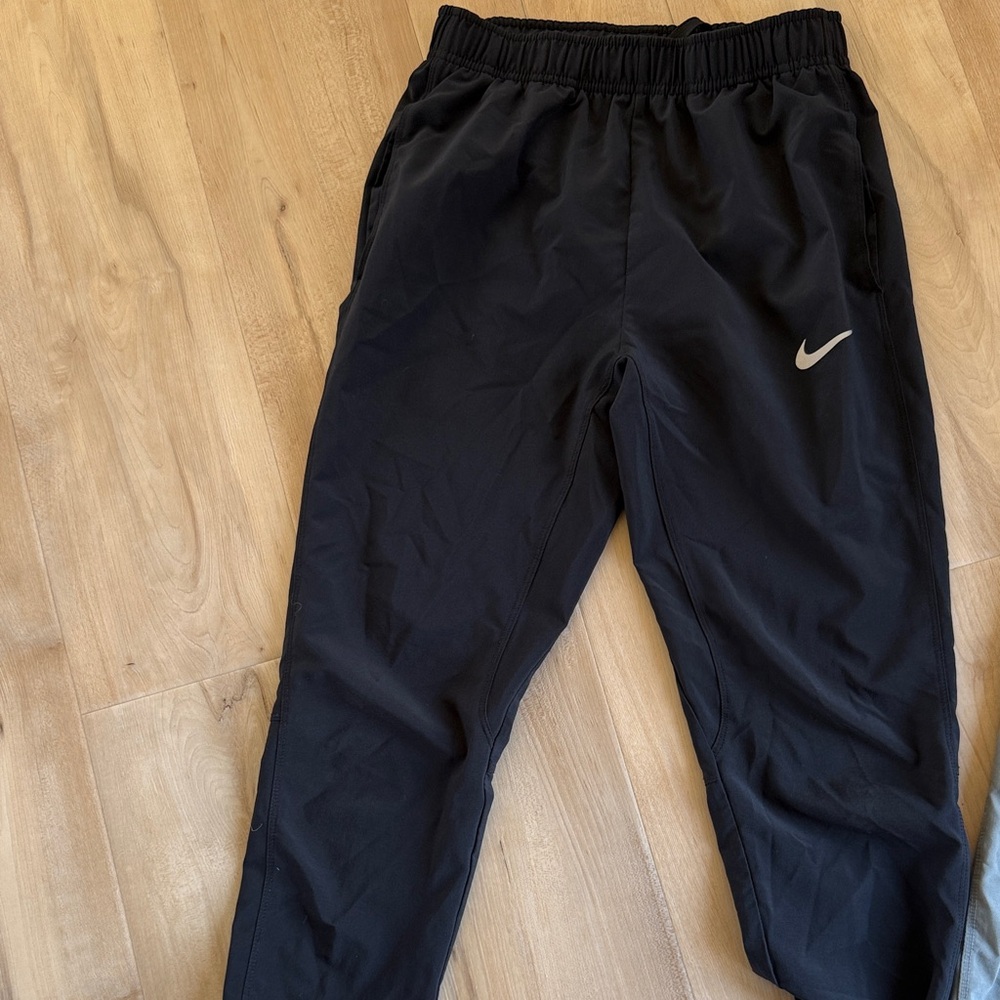 2 pair Nike Kids Black and gray Drifit  pants.